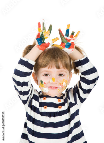 girl with hands soiled in a paint.