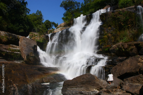 A man photograph waterfall  north of Thailand