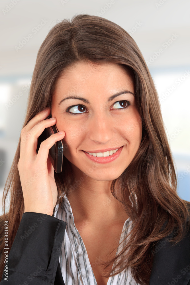 Beautiful businesswoman talking at the phone Beautiful businesswoman talking at the phone