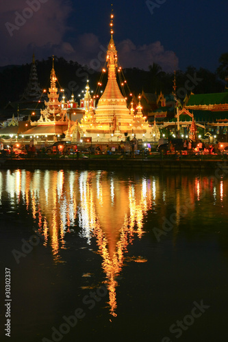 The pagoda reflect the water in the night, Maehongsorn, North of