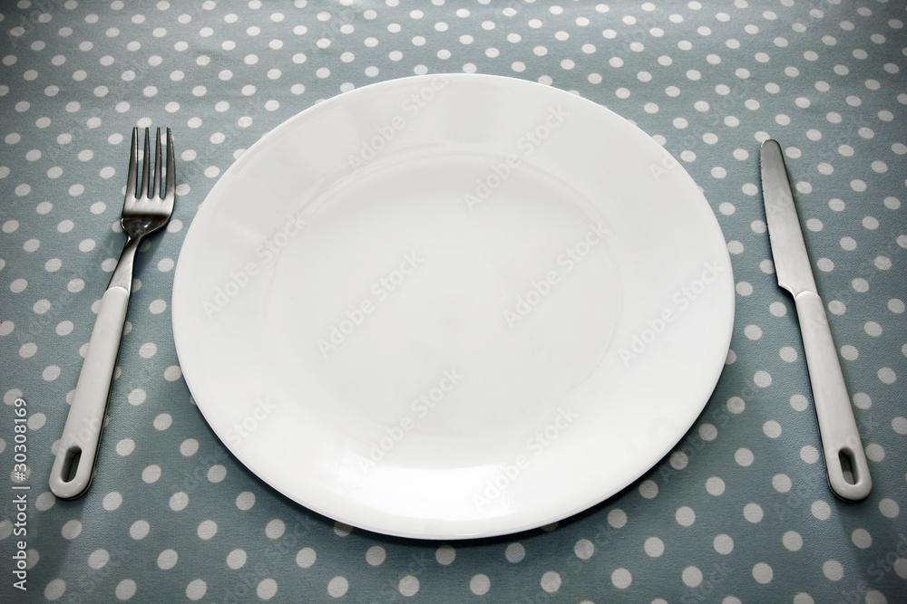 Place setting white plate and grey polka dot