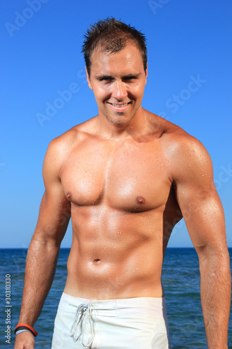 man posing in a beach