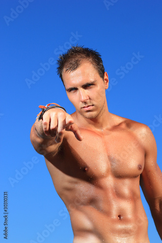 man posing in a beach