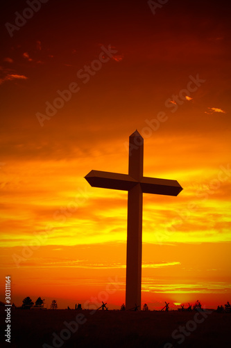 Christian cross silhouette during sunset