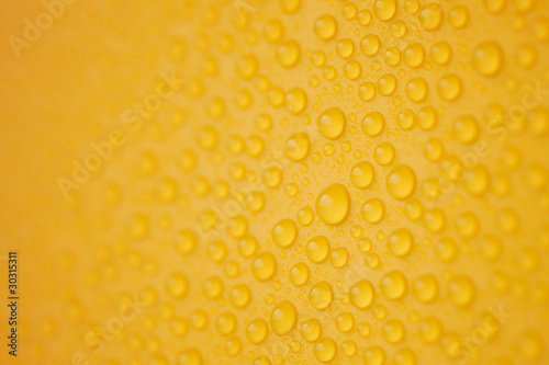Abstract water-drops on yellow
