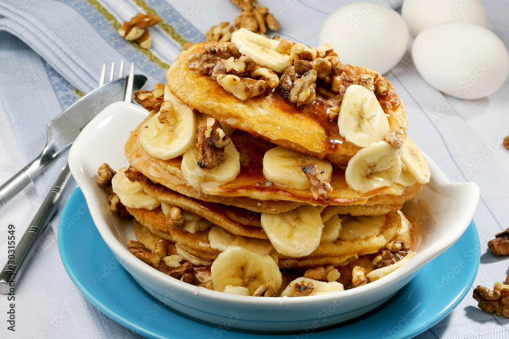 stack of tasty golden pancakes with slices of banana stack of tasty golden pancakes with slices of banana
