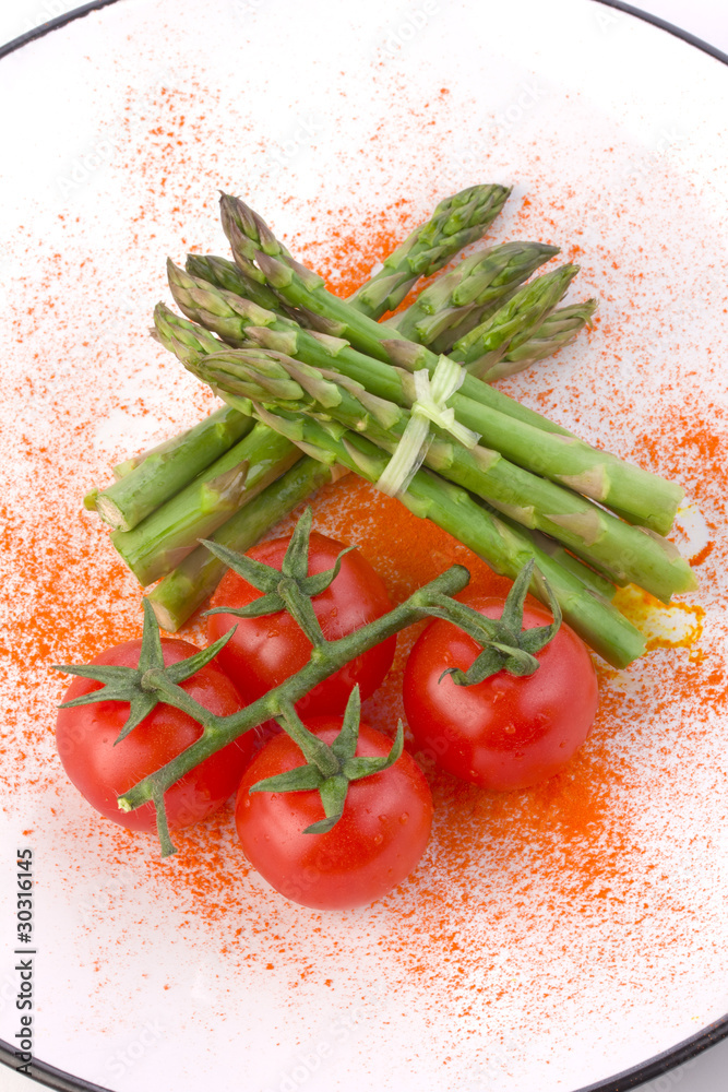 Fresh asparagus and tomatoes Fresh asparagus and tomatoes