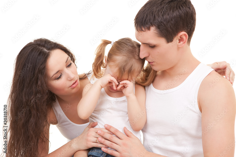 Mother and father becalm daughter on the white background Mother and father becalm daughter on the white background