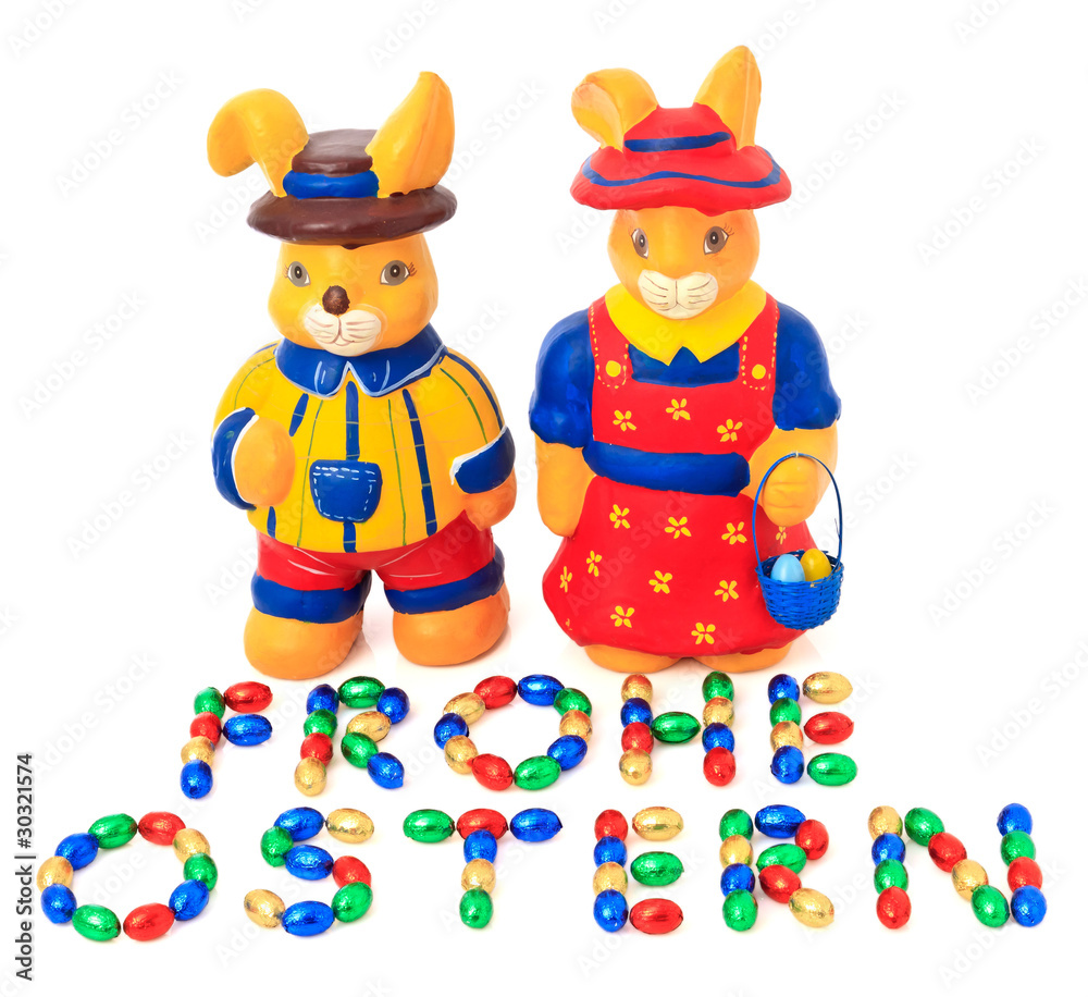 Fototapeta premium Frohe Ostern - mit Schokoladeneier geschrieben - Osterhasen
