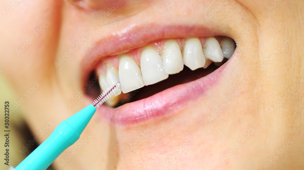 Obraz premium Girl with Interdental Brushes