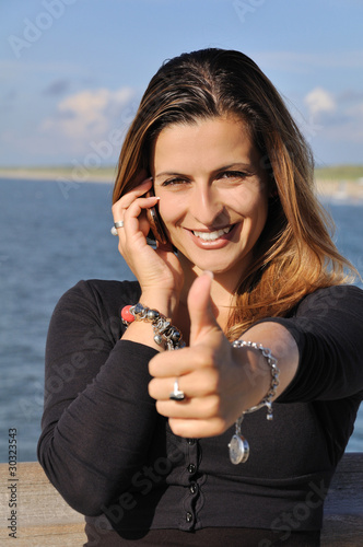 Business woman talking on mobile phone photo