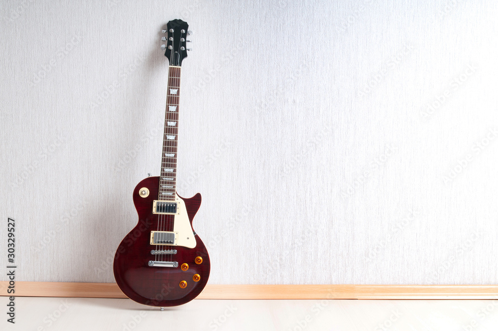 Naklejka premium Musical concept with wooden guitar