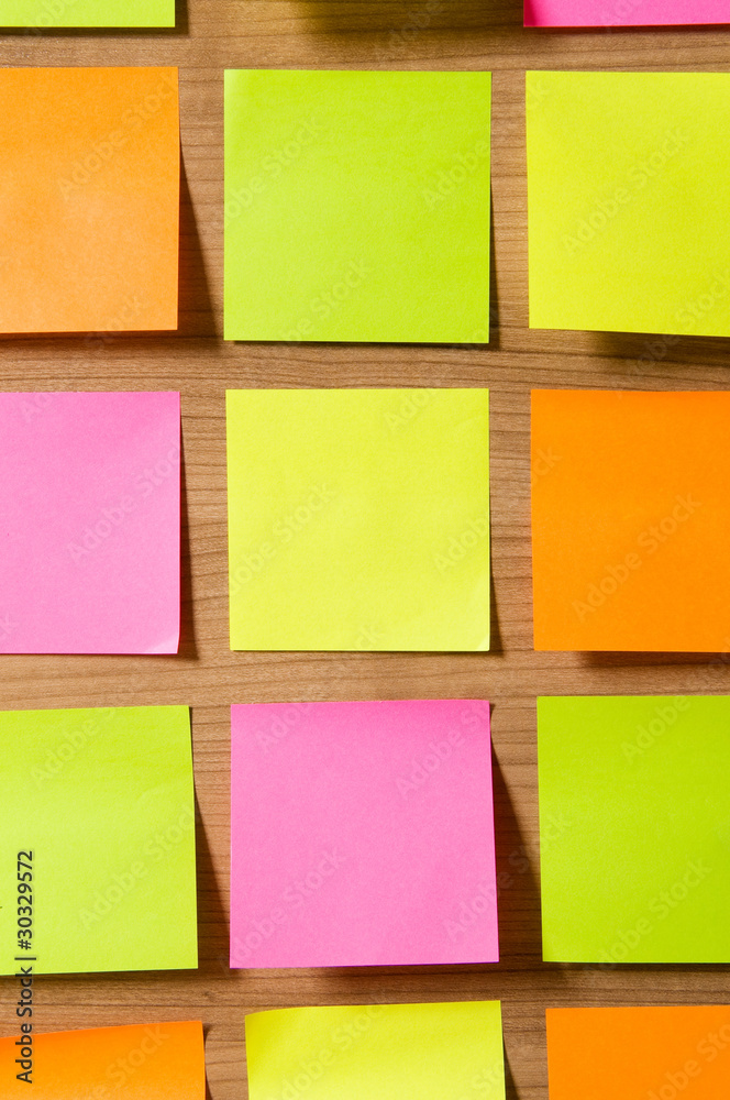 Fototapeta premium Many reminder notes on the wooden background