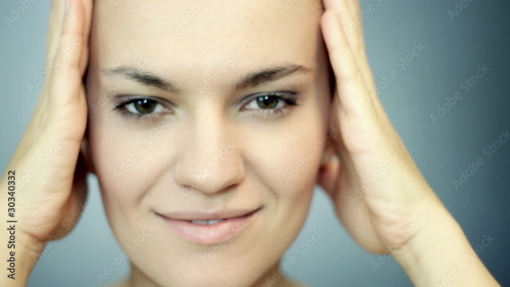 Attractive sexy woman posing and touching her face Attractive sexy woman posing and touching her face
