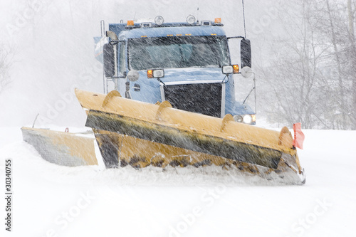 Fotografie Snow plow cleaning street