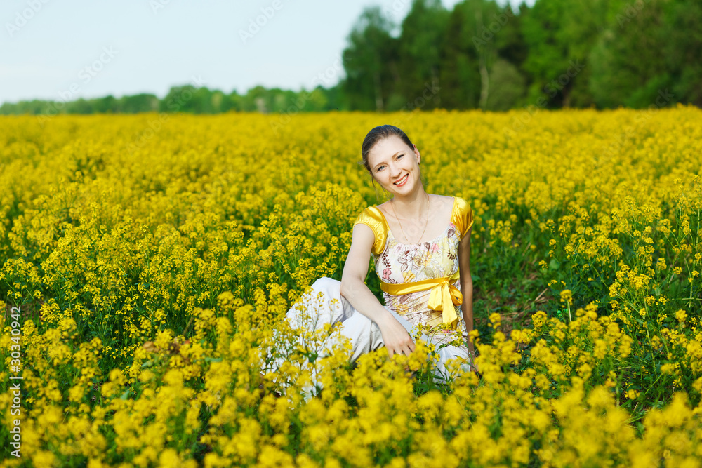 Fototapeta premium happy woman on yellow field
