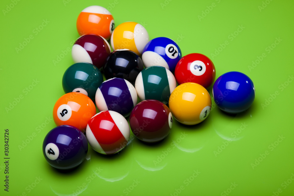 Pool game balls against a green Pool game balls against a green