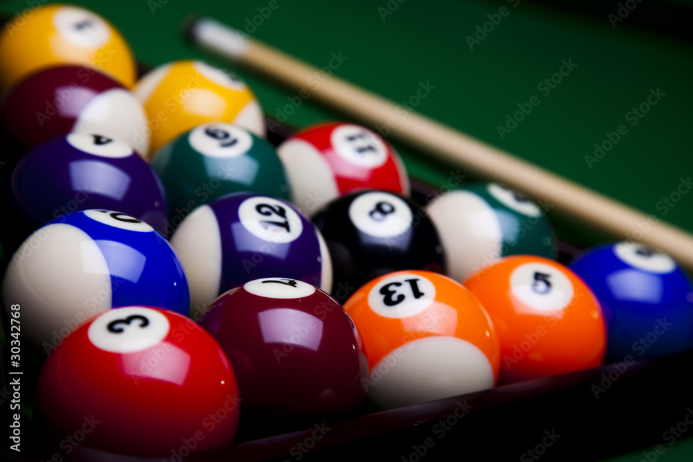 Pool game balls against a green Pool game balls against a green