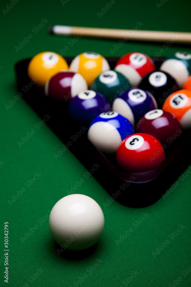 Pool game balls against a green Pool game balls against a green