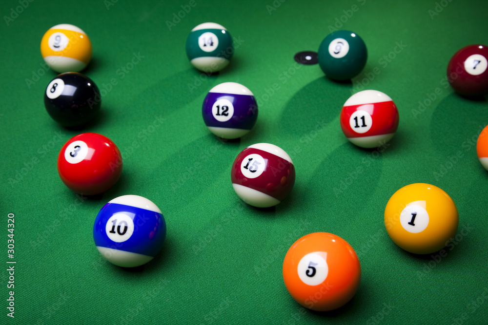 Pool game balls against a green Pool game balls against a green