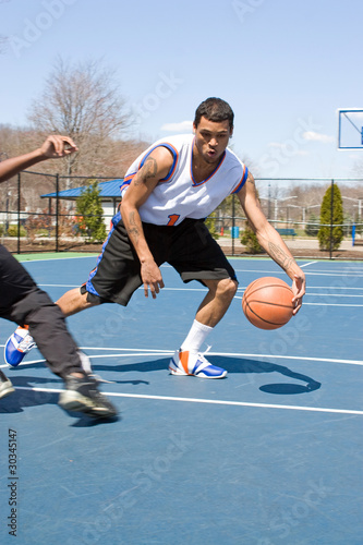 Men Playing Basketball One On One © ArenaCreative