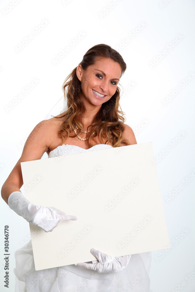 Beautiful smiling bride holding whiteboard Beautiful smiling bride holding whiteboard