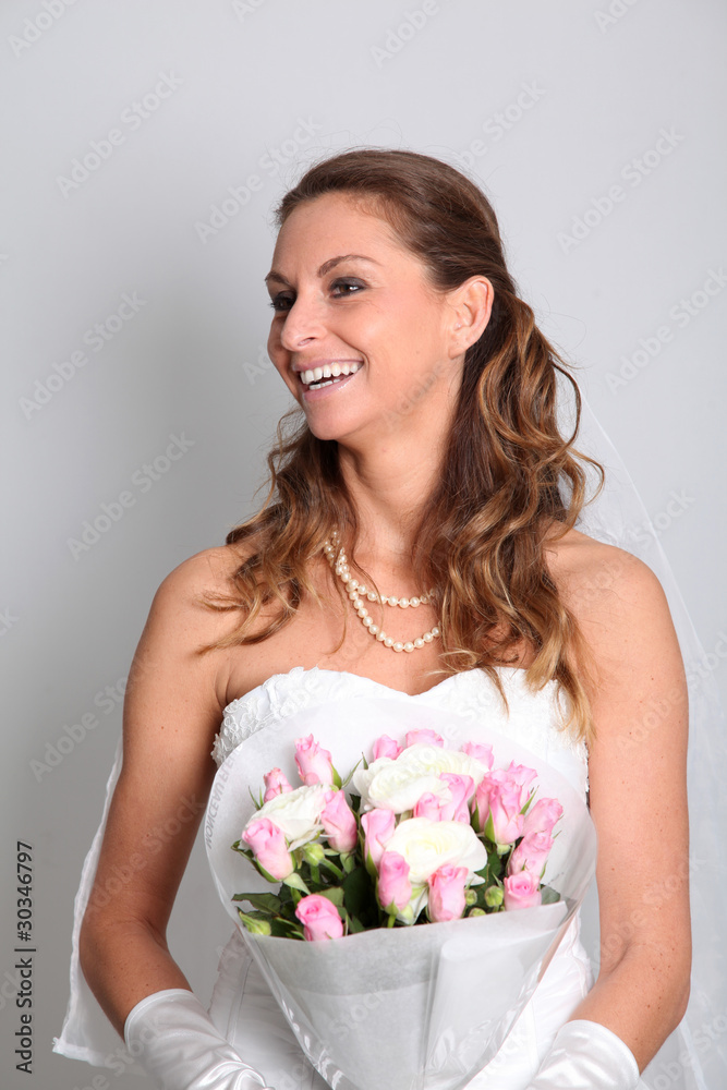 Beautiful bride holding flowers bouquet on white background Beautiful bride holding flowers bouquet on white background