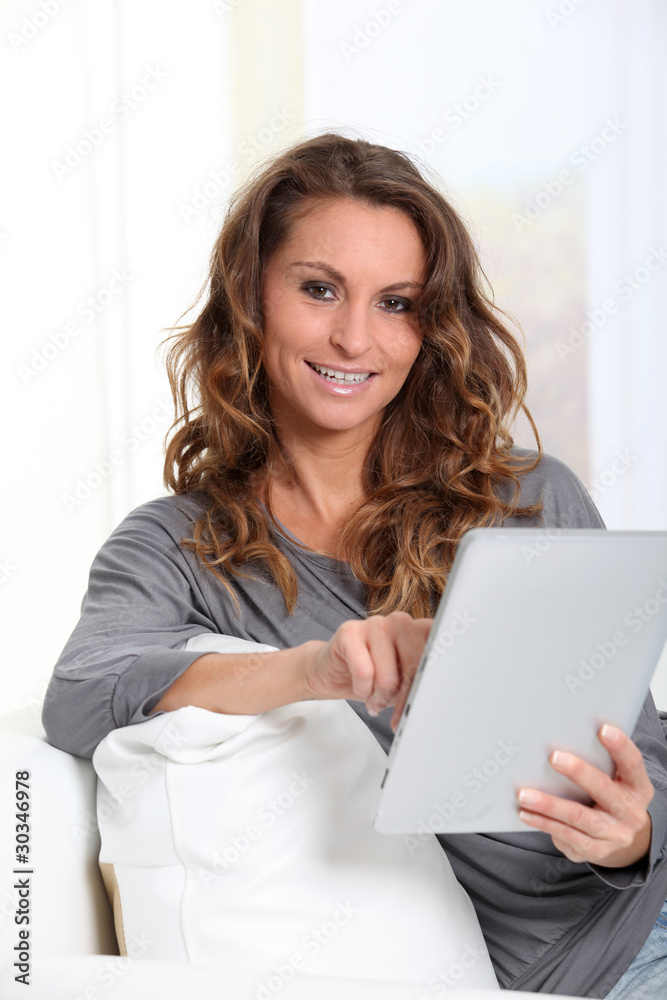 Beautiful woman connected on internet with electronic tablet Beautiful woman connected on internet with electronic tablet