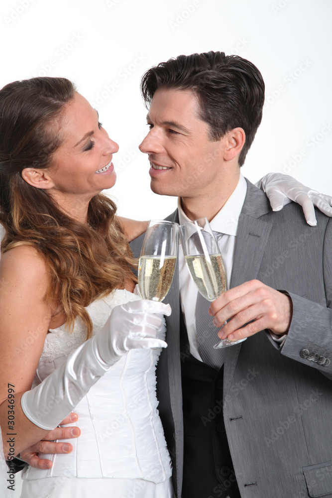 Bride and groom drinking champagne Bride and groom drinking champagne