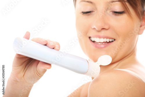 Fotografi Woman using body lotion