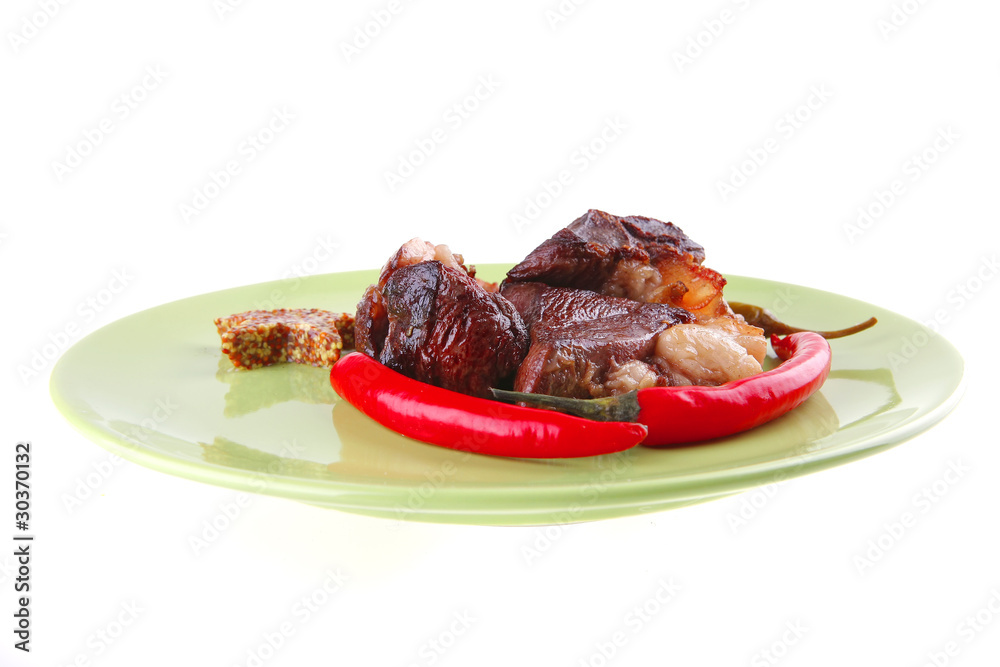 roast meat chunks on green plate