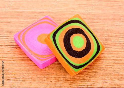 olour erasers on a wooden background photo