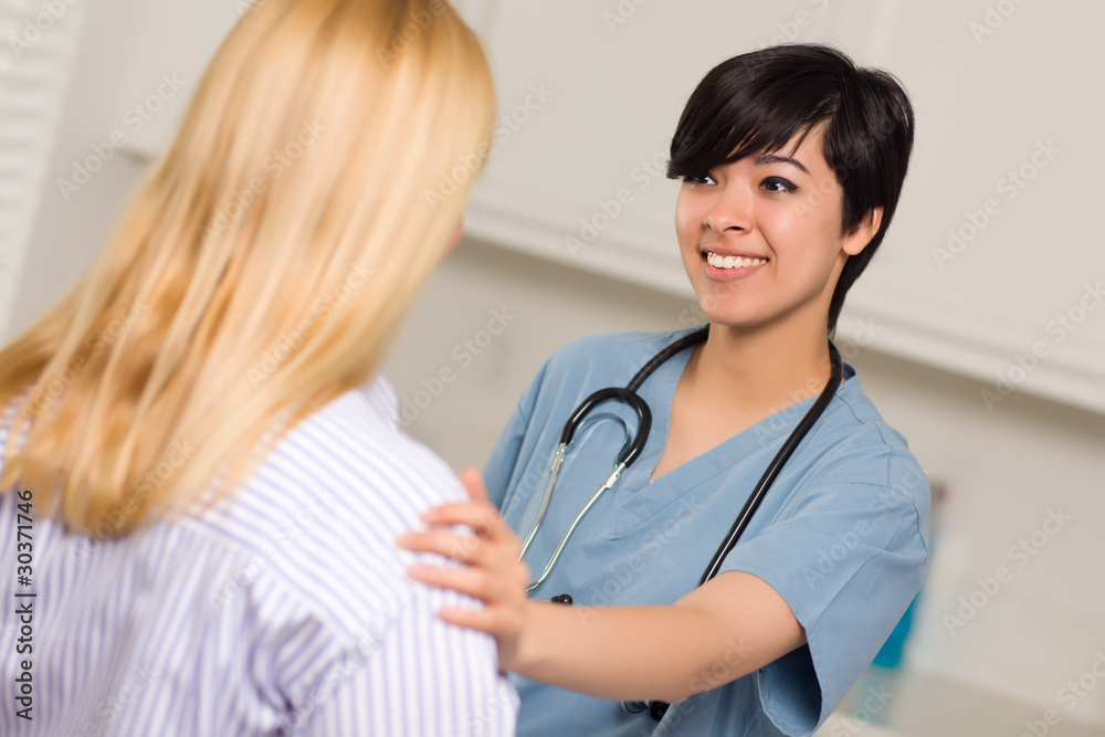 Attractive Multi-ethnic Young Female Doctor Talking with Patient Attractive Multi-ethnic Young Female Doctor Talking with Patient