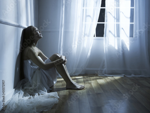 Fotografie Beautiful woman at the window
