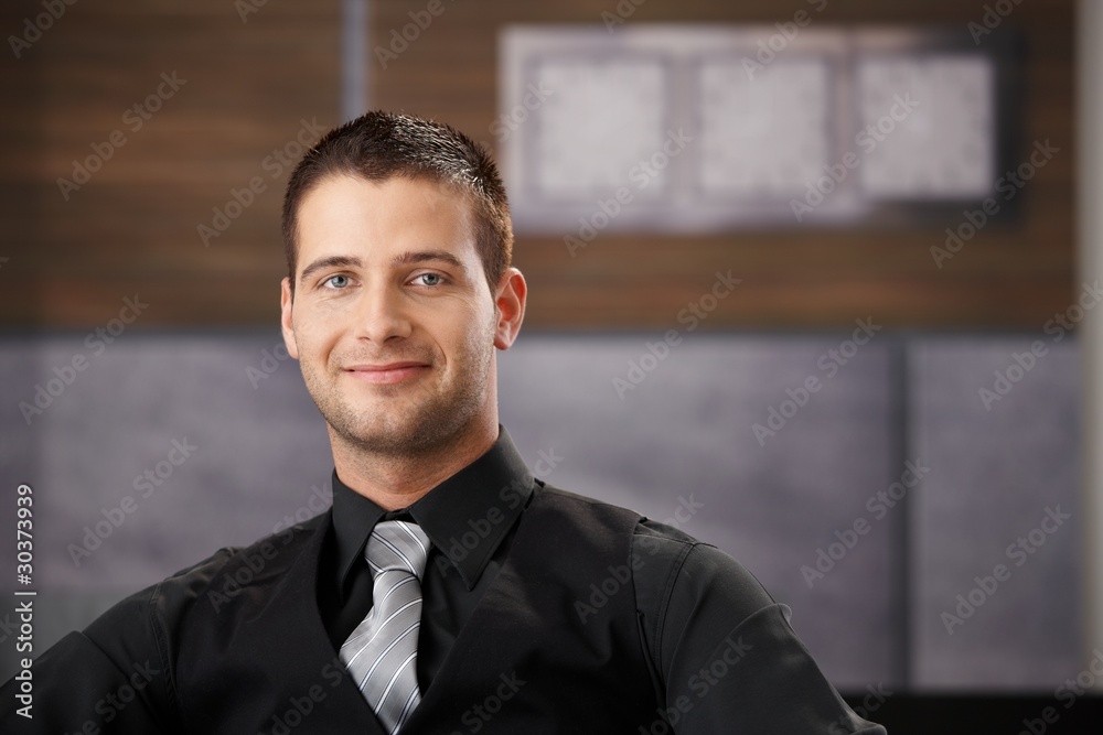 Portrait of goodlooking businessman smiling Portrait of goodlooking businessman smiling