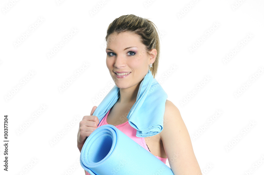 Young woman in sportswear with fitness accessories Young woman in sportswear with fitness accessories