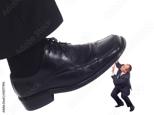 Shoe crushing a businessman
