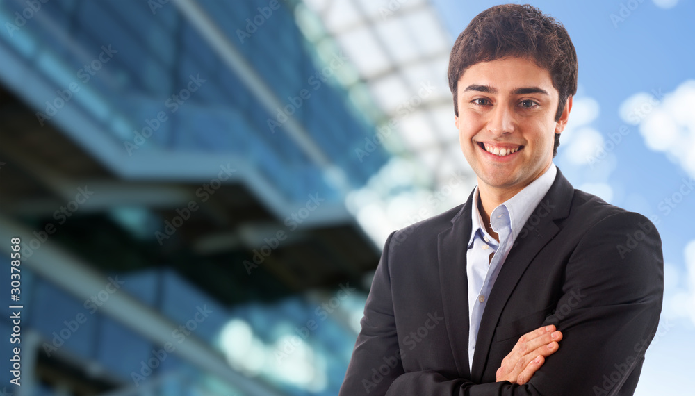 Young businessman smiling Young businessman smiling