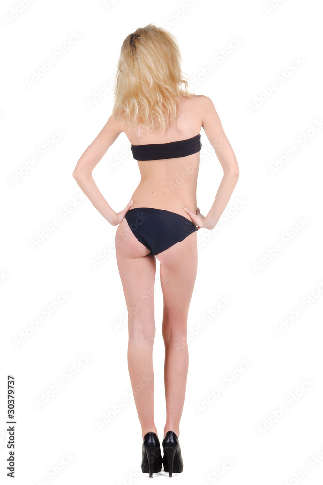 Beautiful young woman looking at wall. Rear view. Beautiful young woman looking at wall. Rear view.