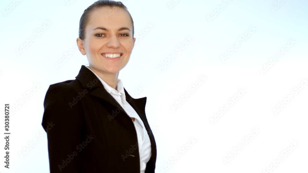 Young smiling businesswoman showing thumb up sign, isolated Young smiling businesswoman showing thumb up sign, isolated