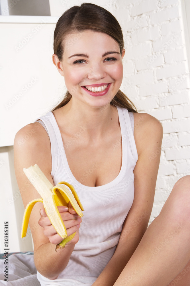 Beautiful woman eating banana Beautiful woman eating banana