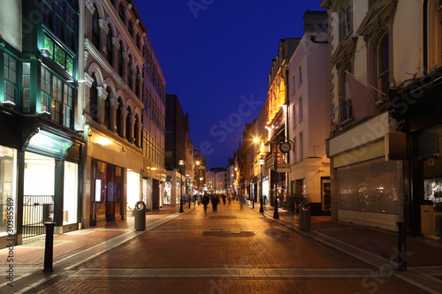 Fototapeta Naklejka Na Ścianę i Meble -  Grafton Street South End, shop windows at night in Dublin