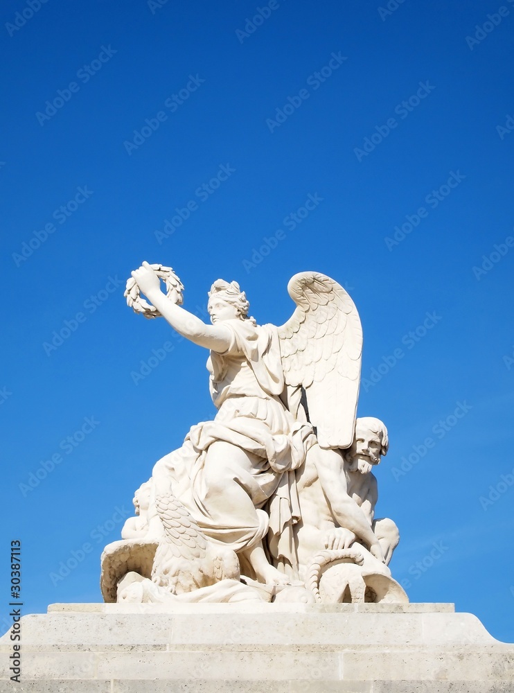 Statue in facade of Versailles Chateau entrance