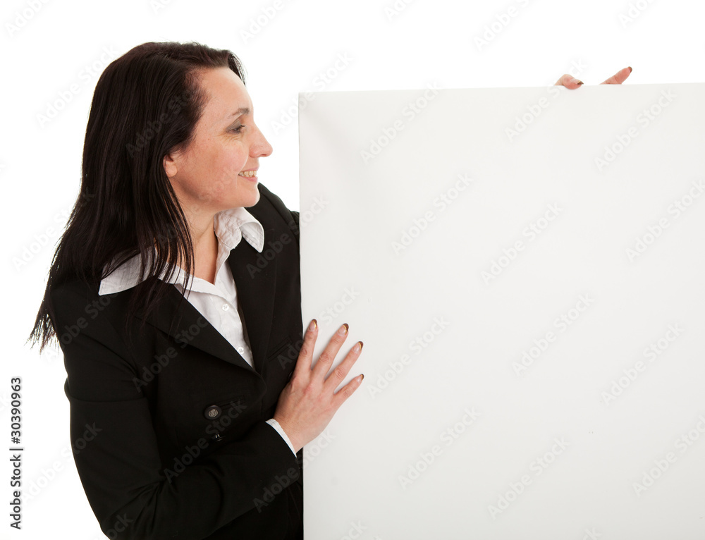 Cheerful businesswomen presenting empty board Cheerful businesswomen presenting empty board