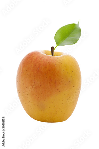 fresh yellow apple with green leaf