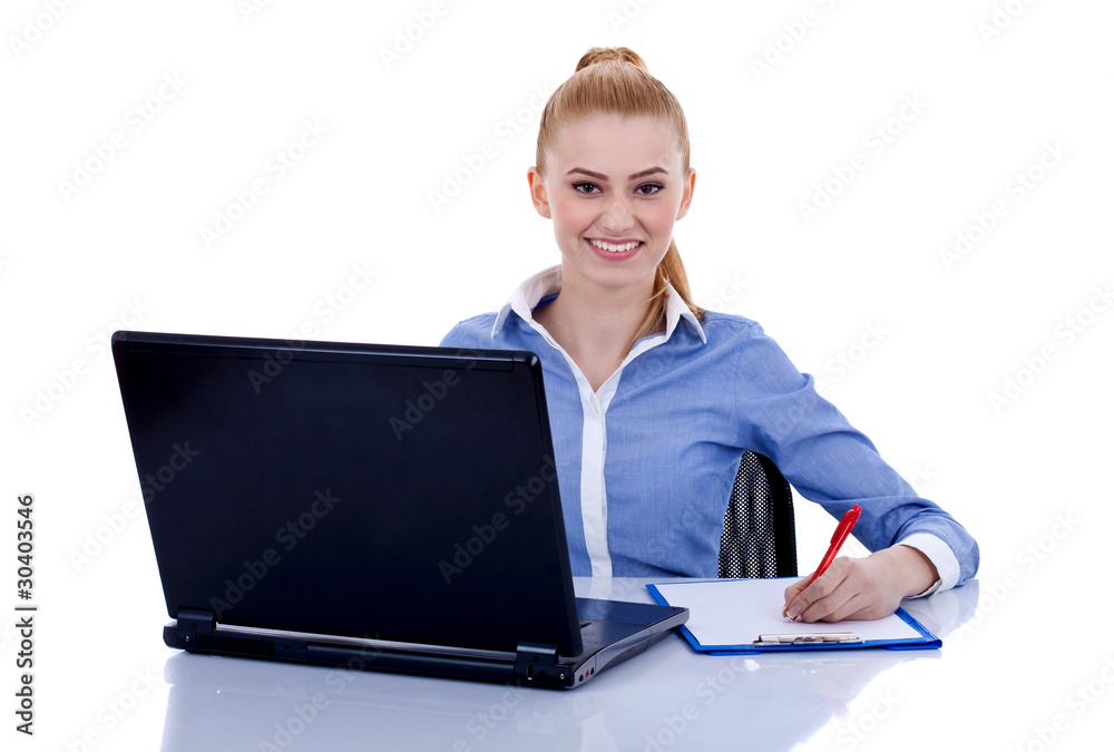 businesswoman behind the desk writing businesswoman behind the desk writing