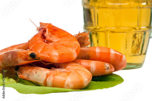 Fresh shrimp on lettuce leaf and a glass of beer