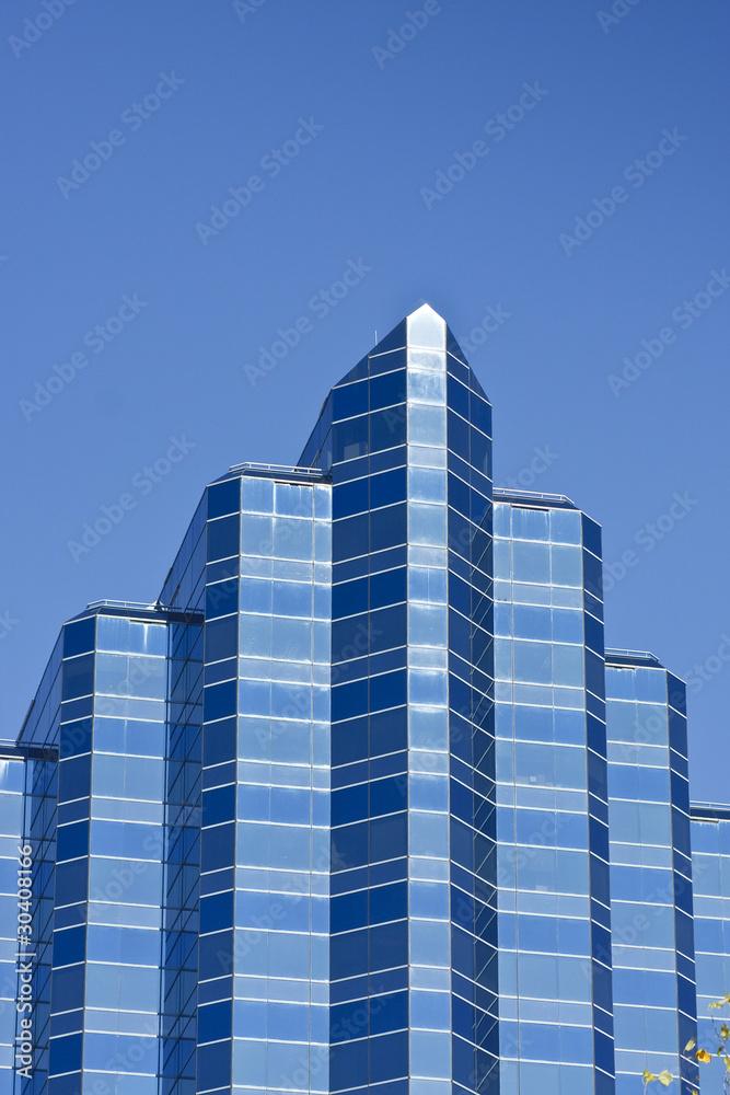 Blue Angled Office Tower on Deep Blue Sky