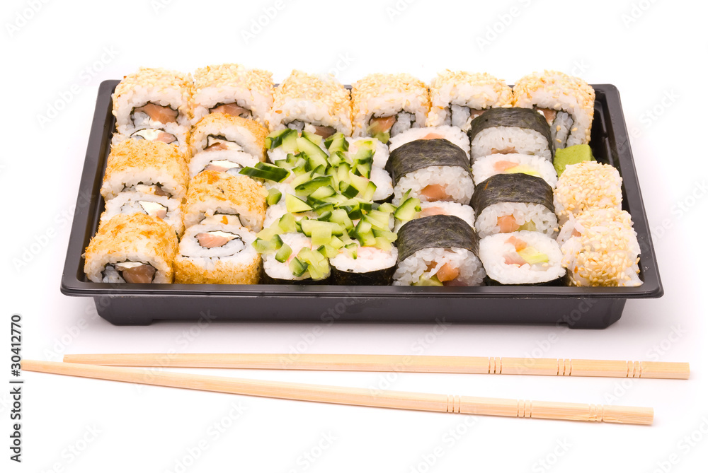 Sushi with chopsticks isolated on a white background Sushi with chopsticks isolated on a white background