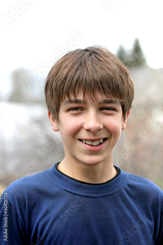 smiling young and happy teenager portrait outdoor © Sabphoto